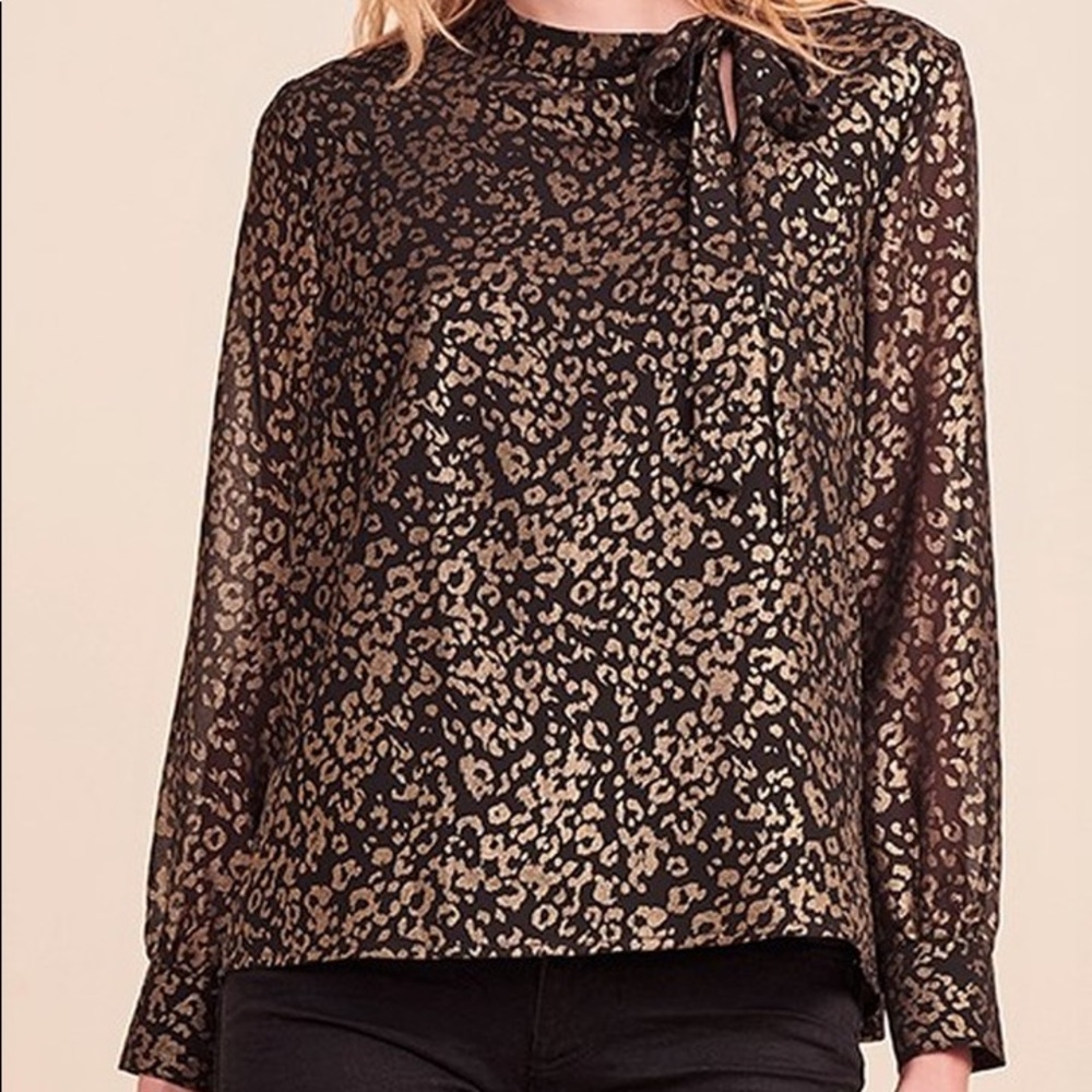 Leopard print blouse with tie neck.